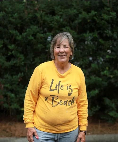 Mobility Concepts crew member in a yellow sweatshirt