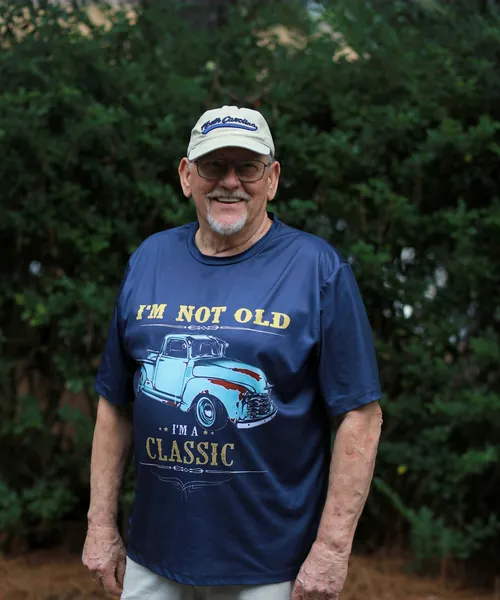 Mobility Concepts crew member in a navy T-shirt and cap