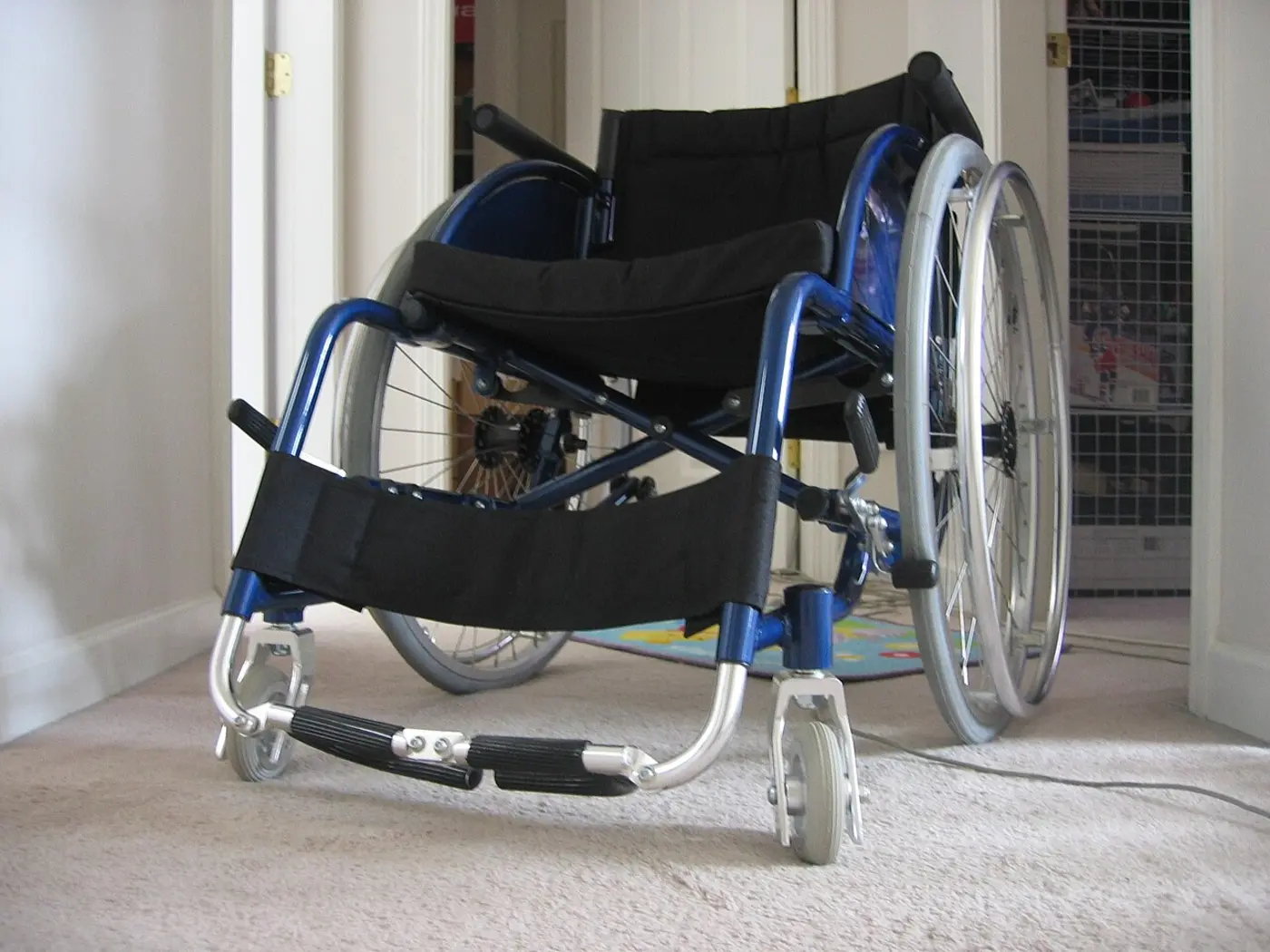 Blue folding manual wheelchair